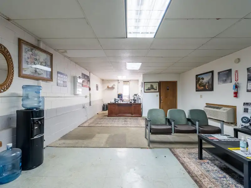 Mixed-use Property with 1-bedroom Apartment in Well-maintained Building